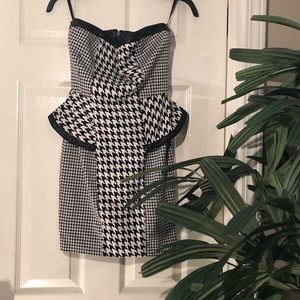 Peplum houndstooth leather trimmed dress